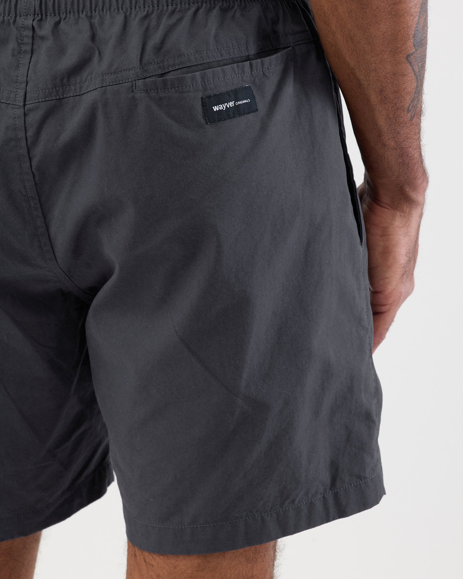 Graphite cotton beach shorts with a Wayver brand logo on a white background