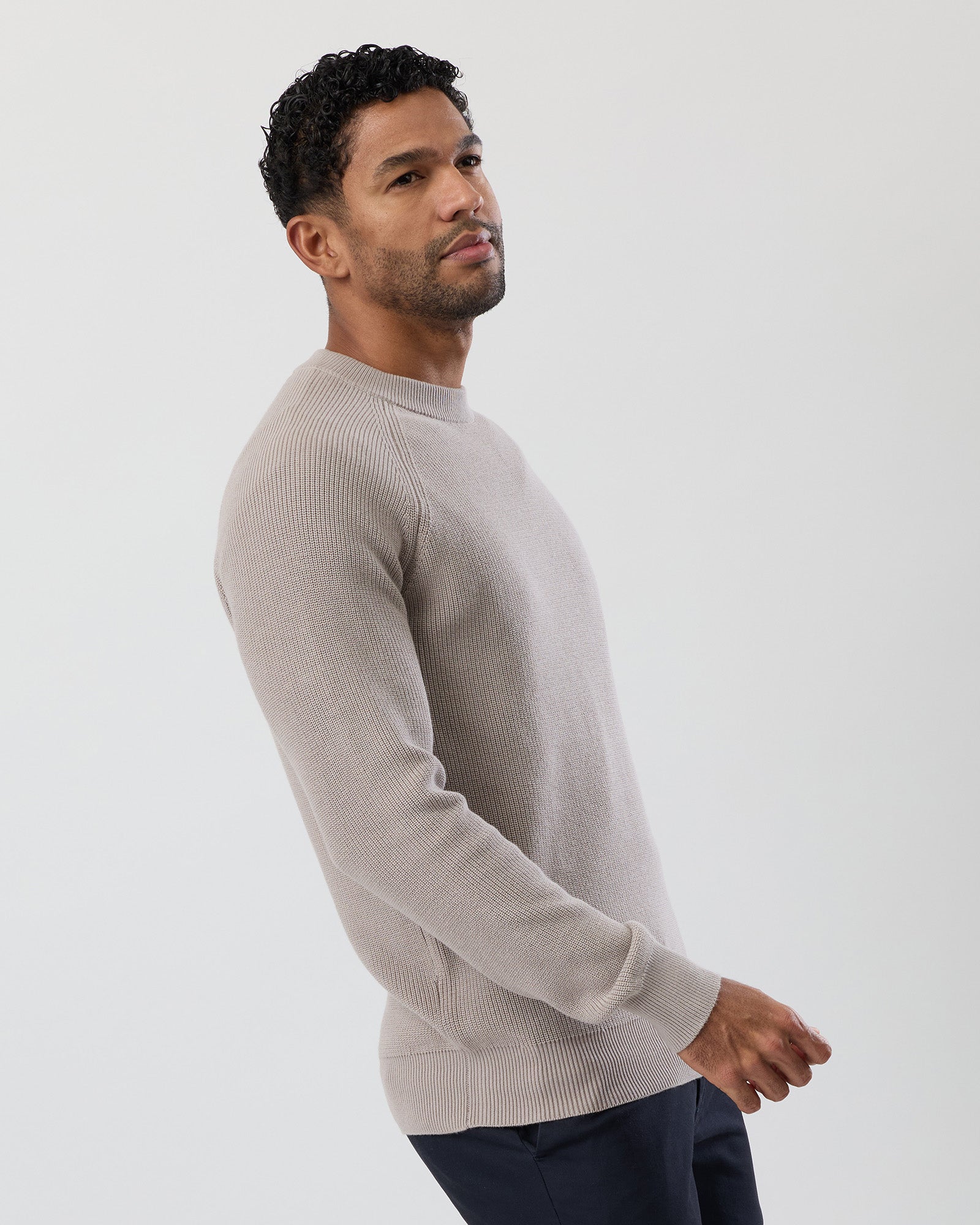 Side profile of a men's knit top