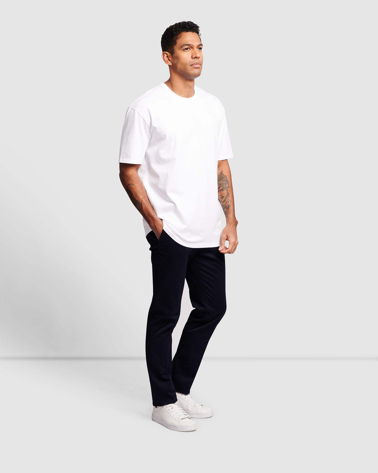 Model wearing a white oversized cotton t-shirt, full body view