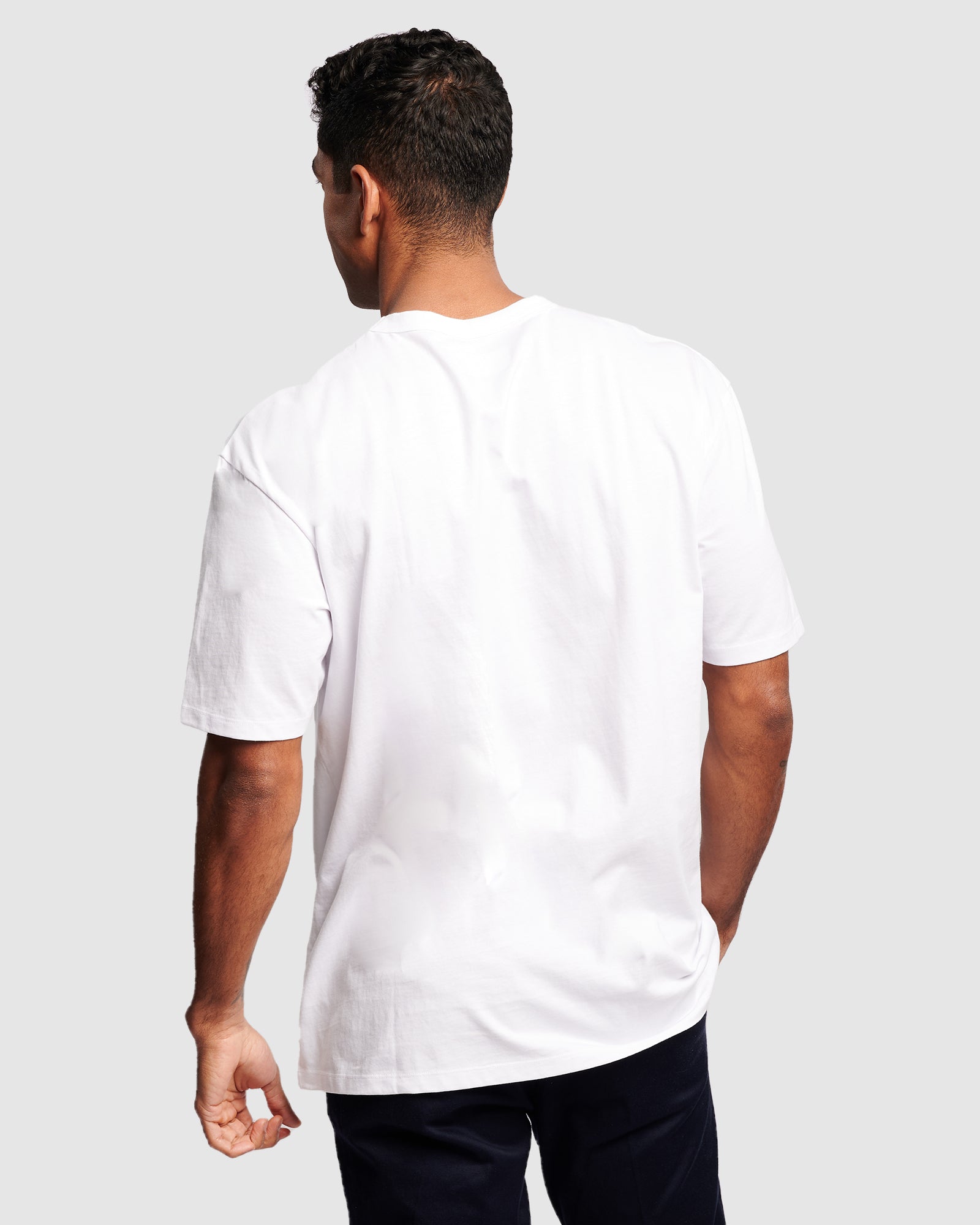 Essential men’s oversized t-shirt worn solo – elevated basics, rear view