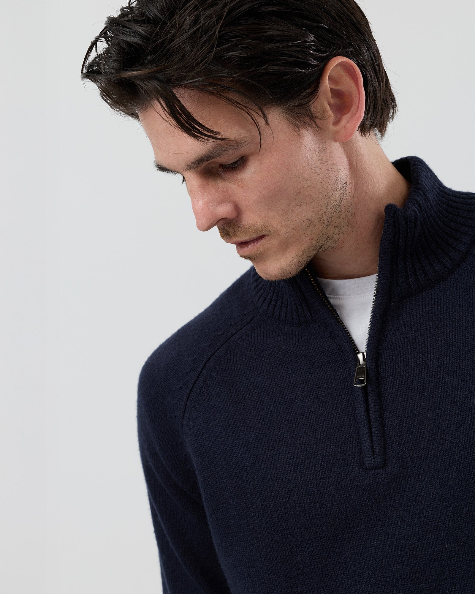 Close-up front view of the Wayver navy wool blend half zip knit showing the YKK metal zip, stand collar and premium knit finish.