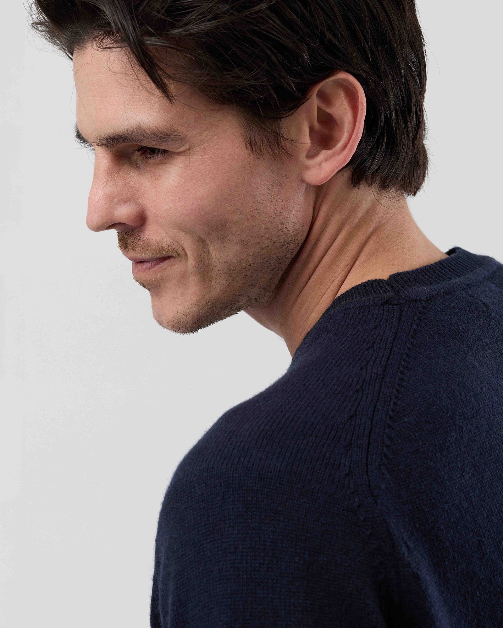 Close-up rear view of the Wayver navy wool blend crew neck knit showing the premium saddle shoulder detail and fine gauge knit texture.