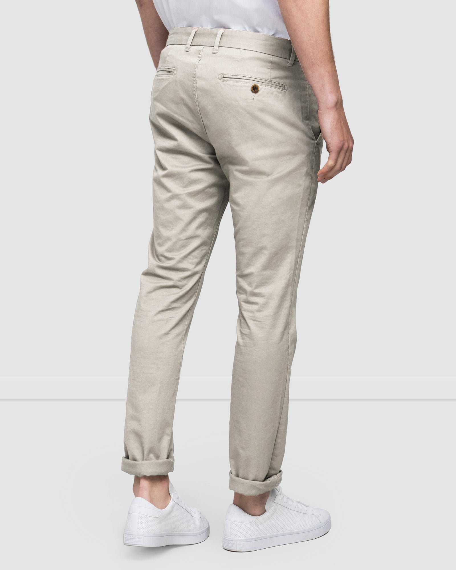 Men's chinos in a compact cotton twill in pebble colour, rear view