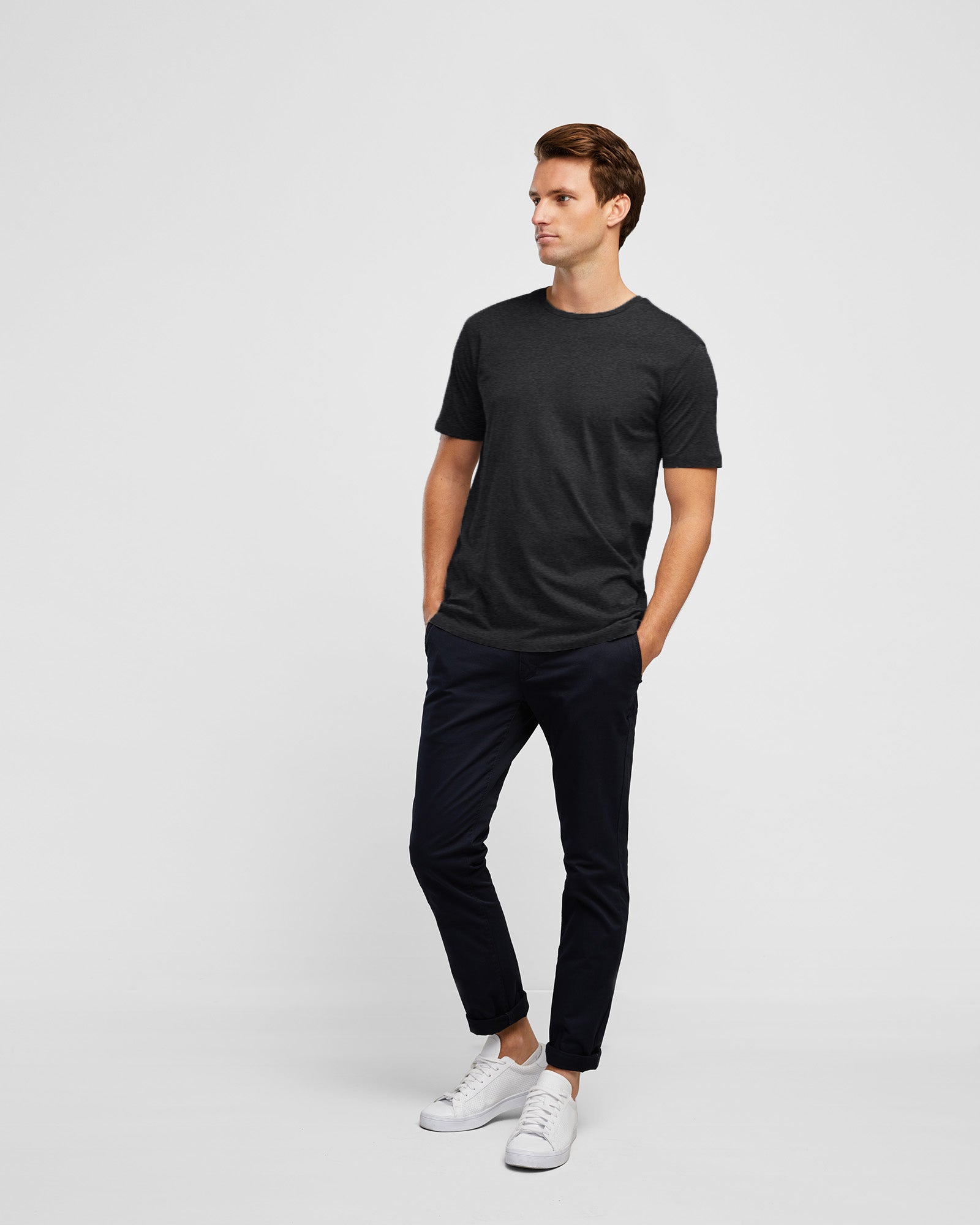 Slim Fitting Men's Crew Neck Tee in Charcoal, full body image on model paired with navy chino pants