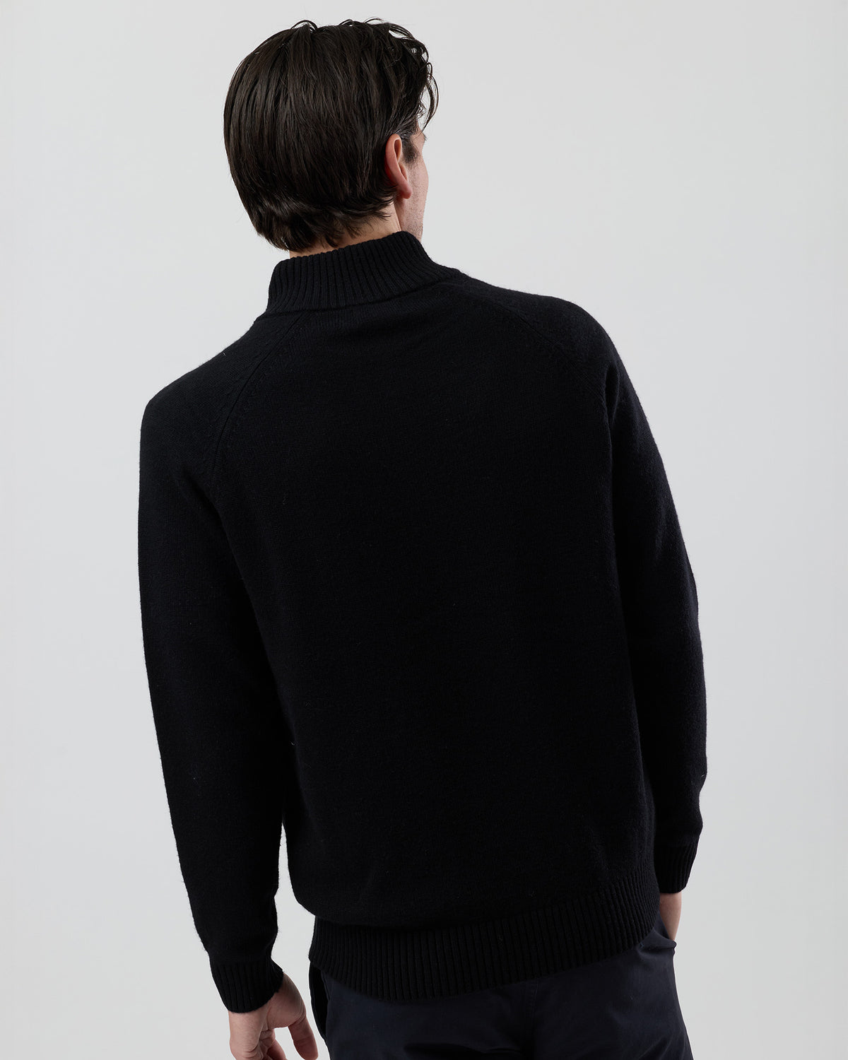 Rear view of the Wayver black wool blend stand collar jumper showing the clean back profile and refined knit finish.