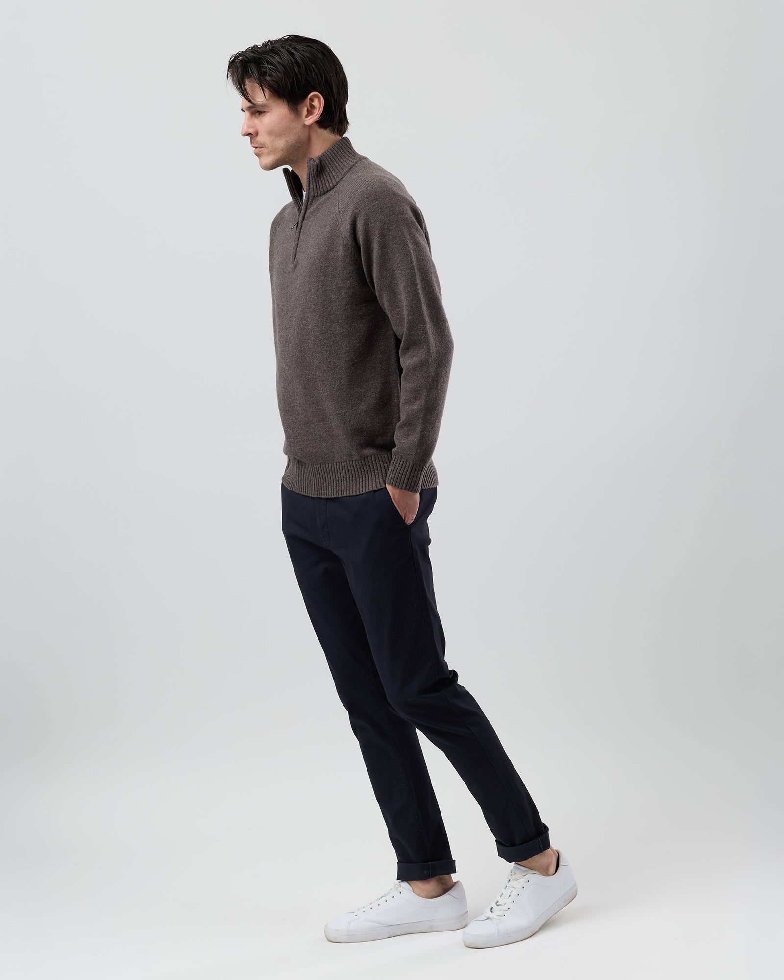Full-length side profile of a men's brown marl wool blend quarter zip jumper showing the regular fit and slim sleeve shape.