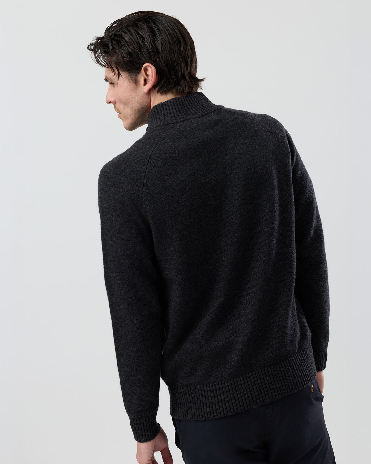 Rear view of the Wayver charcoal wool blend stand collar jumper showing the clean back profile and quality knit finish.