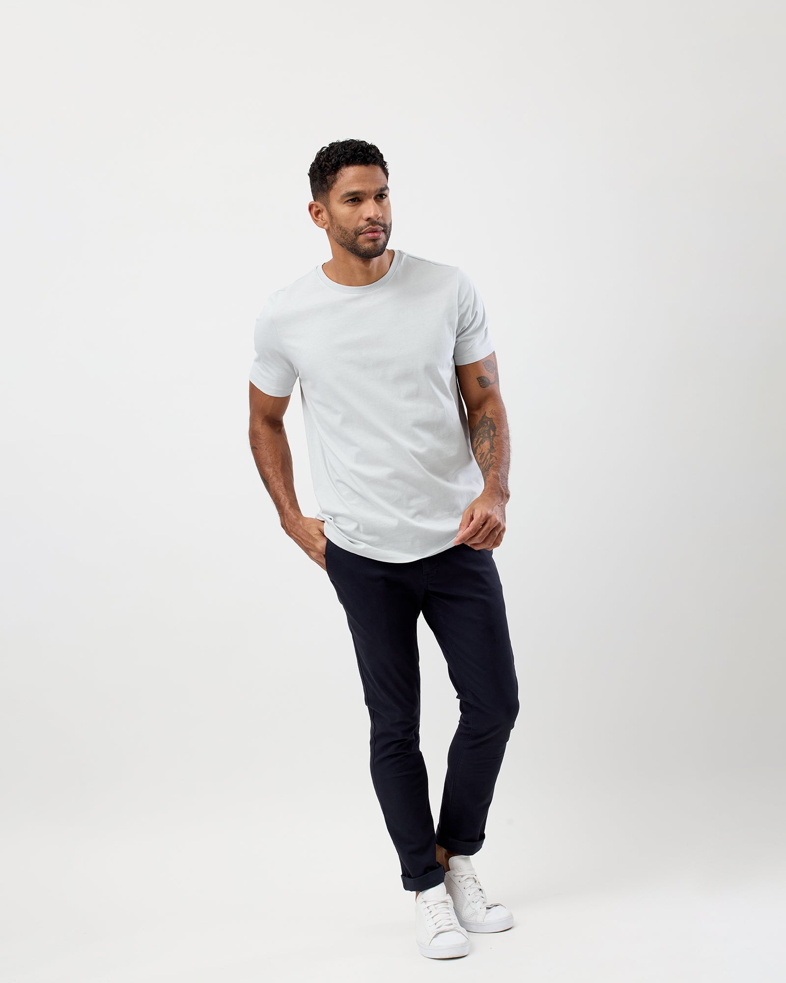 Model wearing men's Glacier Colours Essential crew t-shirt with casual chinos, by Wayver