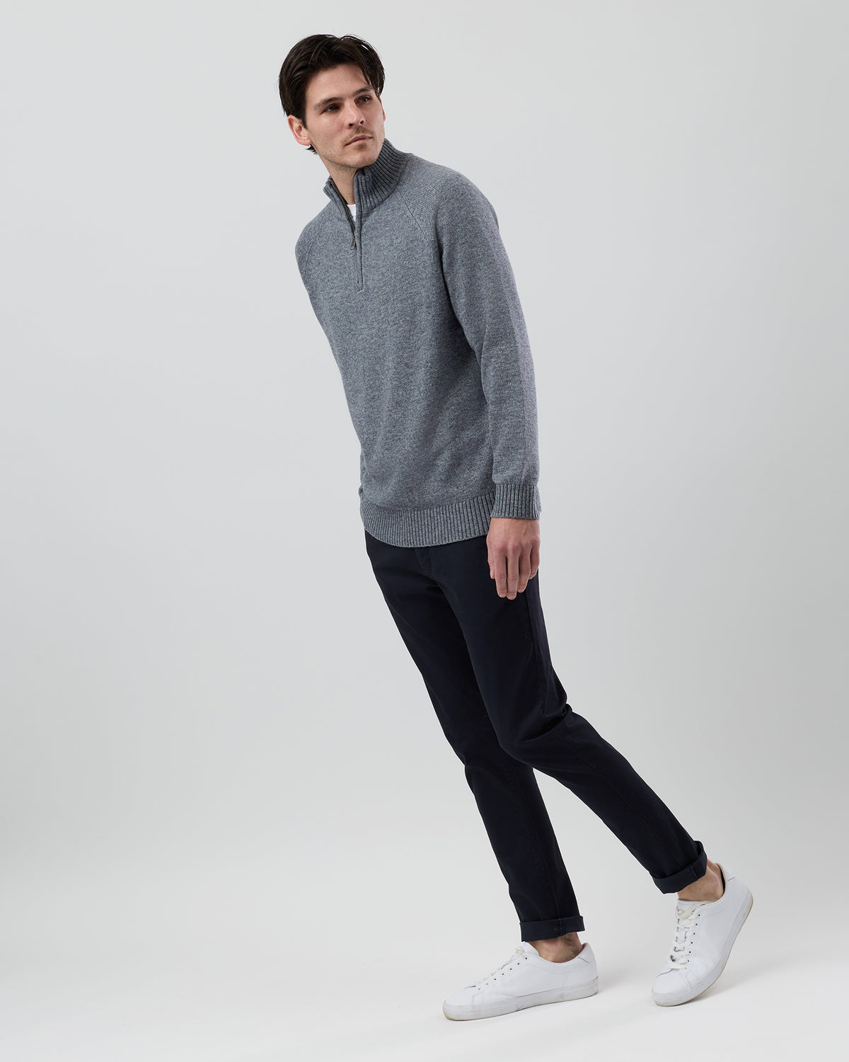 Full-length side profile of a men's grey wool blend quarter zip jumper showing the regular fit and slim sleeve shape.