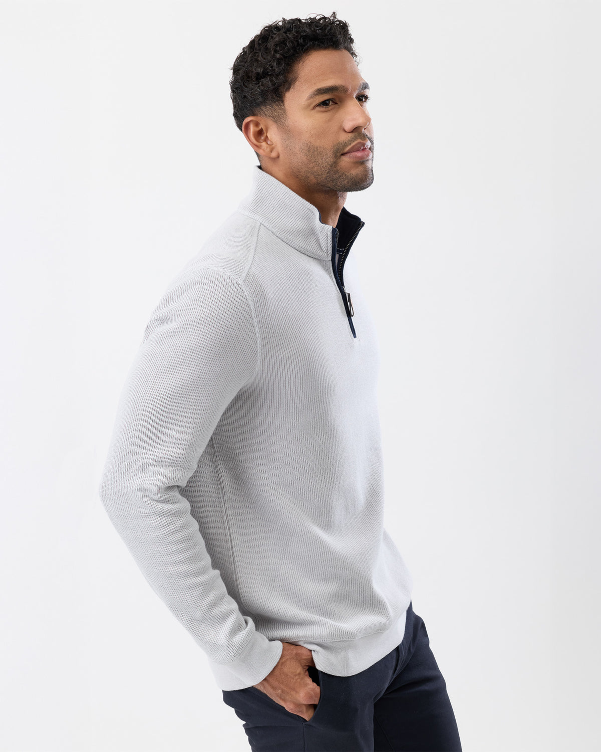 Model wearing French rib half zip sweater – side profile
