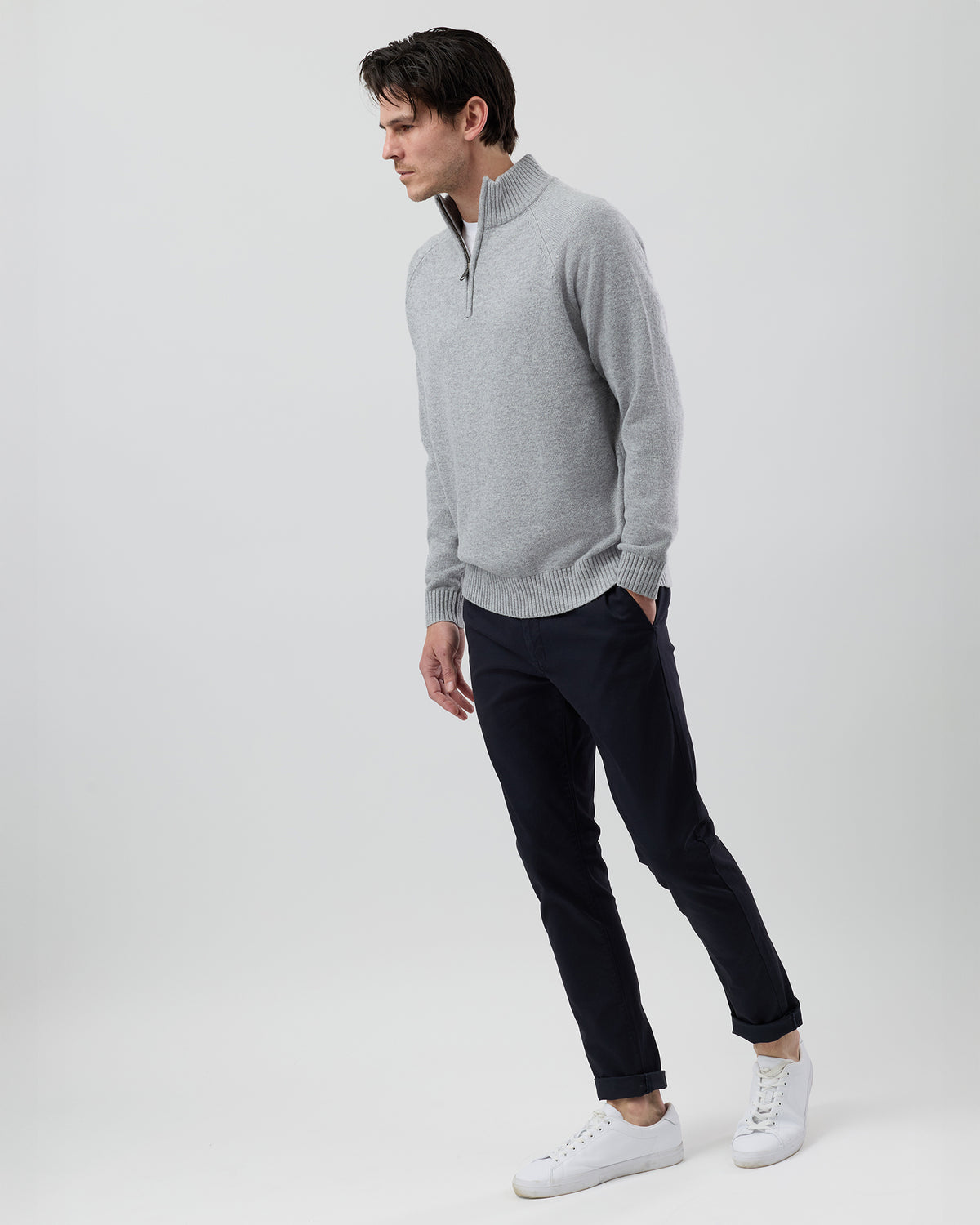 Full-length side profile of a men's light grey wool blend quarter zip jumper showing the regular fit and slim sleeve design.
