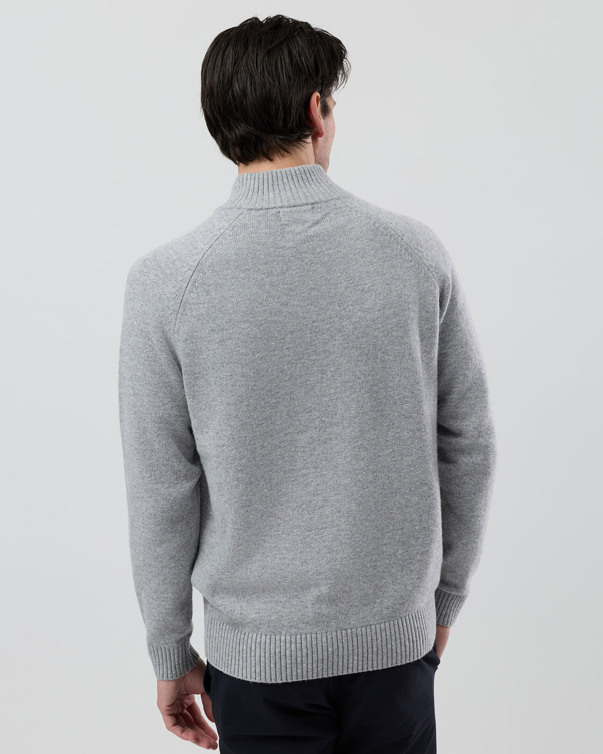 Rear view of the Wayver light grey wool blend stand collar jumper showing the clean shape and classic knit construction.