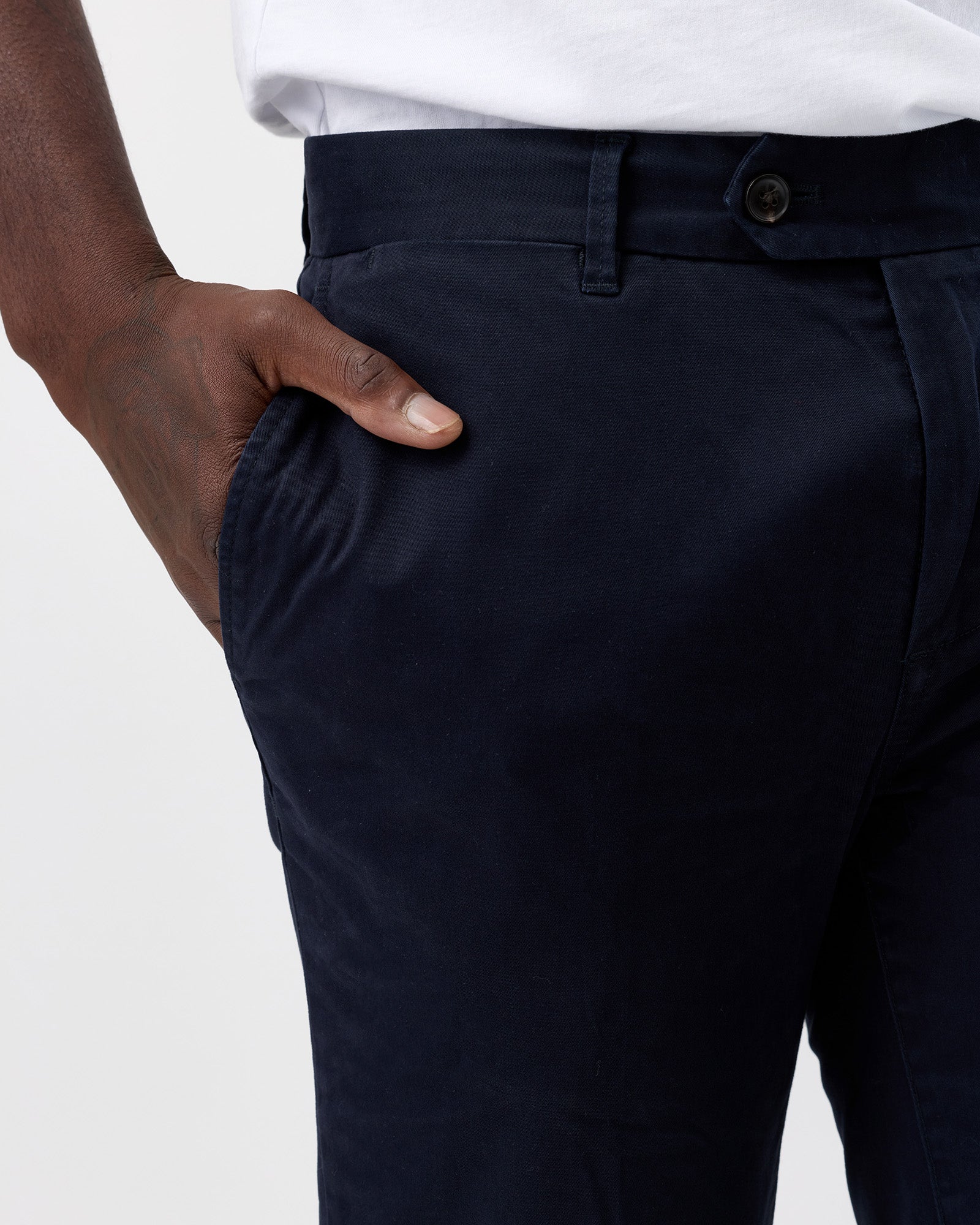 Navy chino trousers by Wayver, close up view