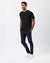 Man wearing a dark charcoal t-shirt against a white background