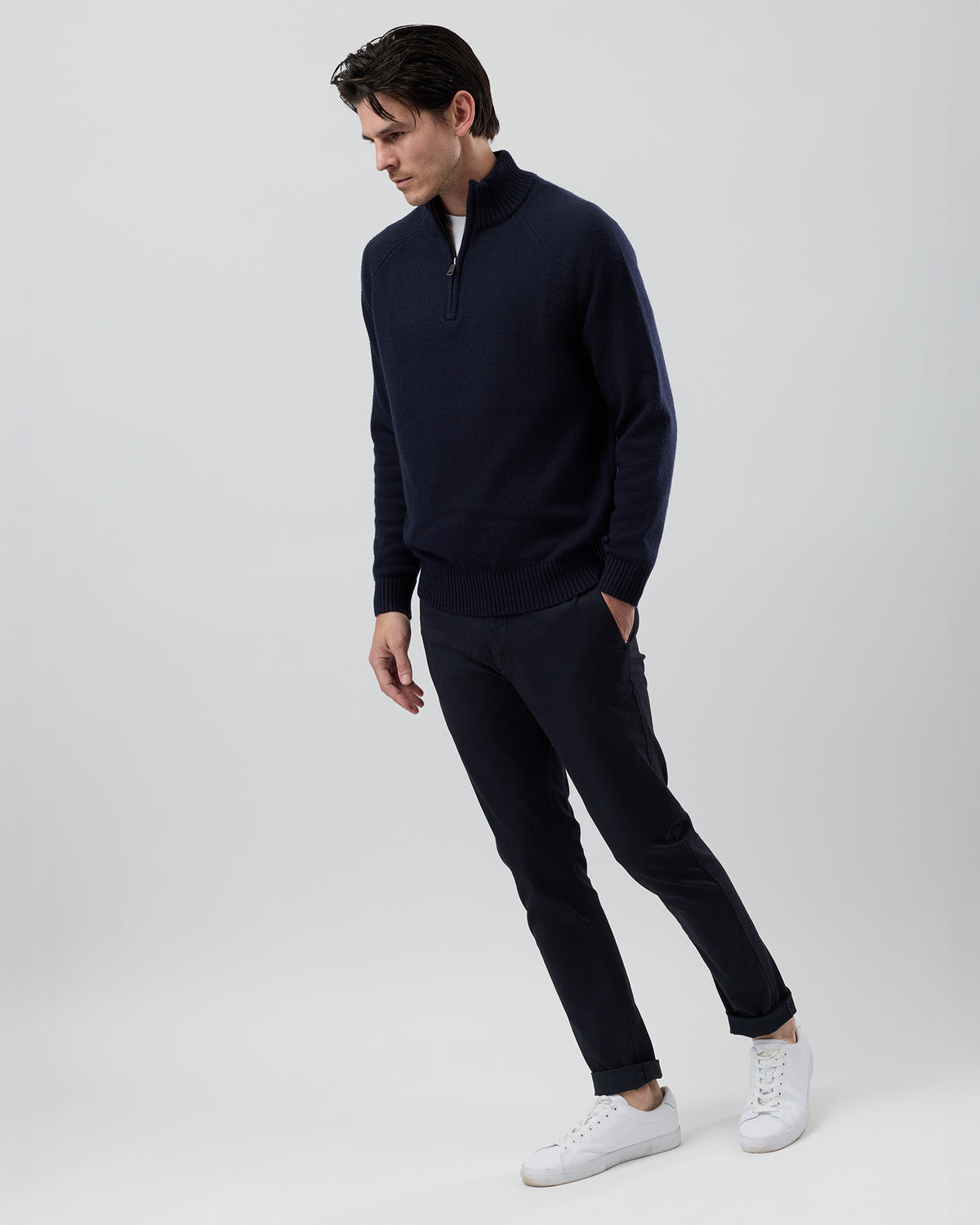 Full-length side profile of a men's navy wool blend quarter zip jumper showing the comfortable regular fit and slim sleeve design.