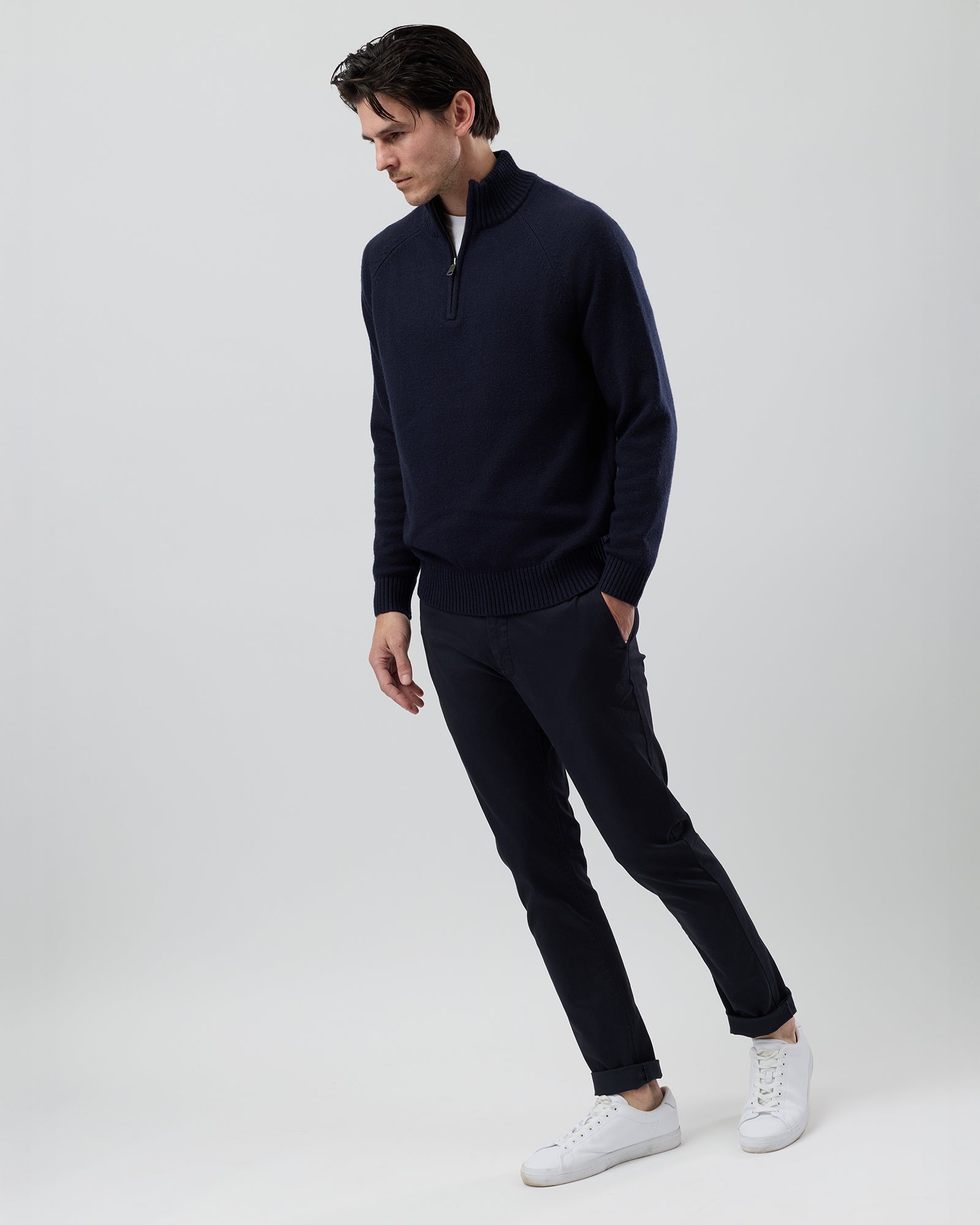 Full-length side profile of a men's navy wool blend quarter zip jumper showing the comfortable regular fit and slim sleeve design.