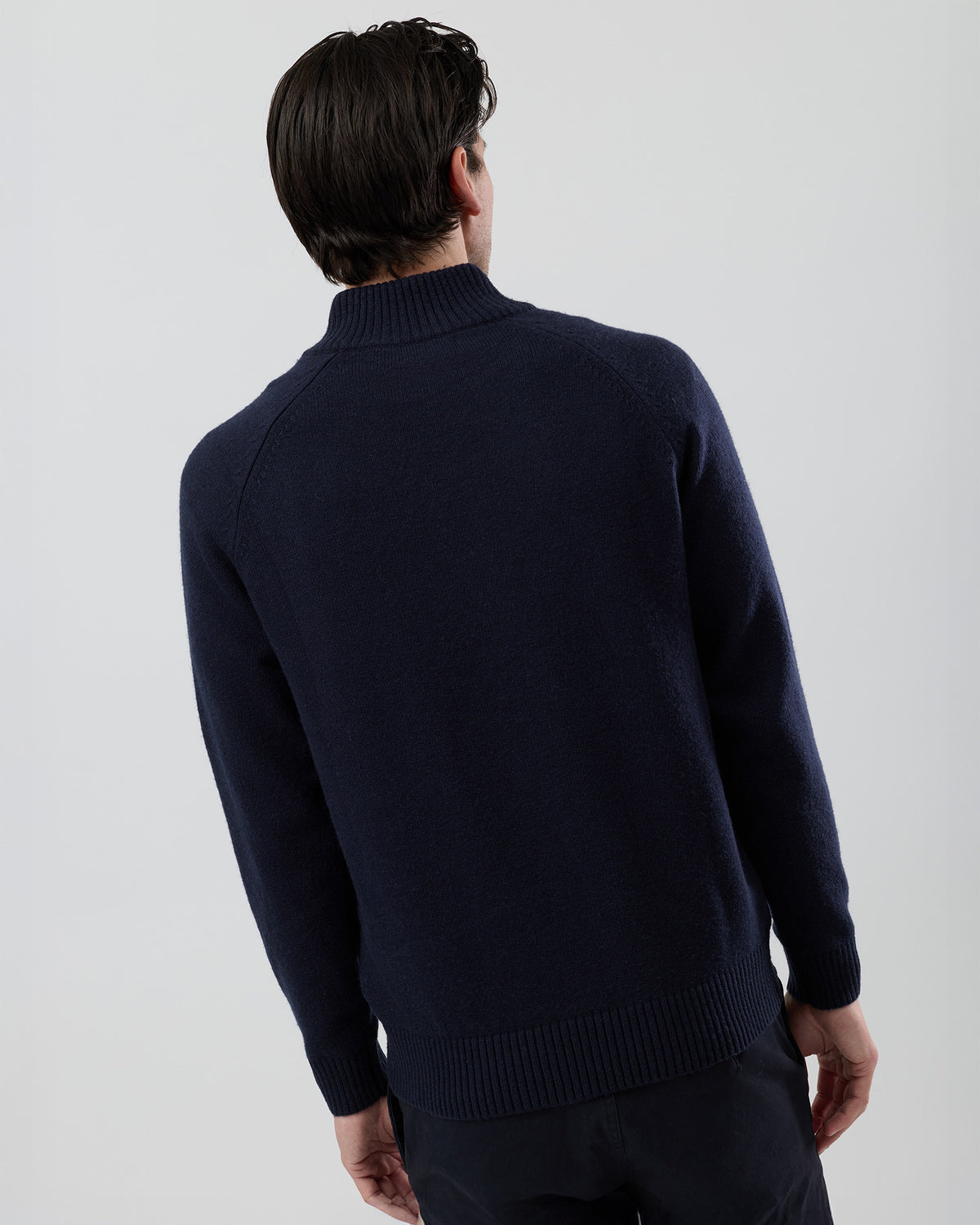 Rear view of the Wayver navy wool blend stand collar jumper showing the clean shape and classic knit construction.