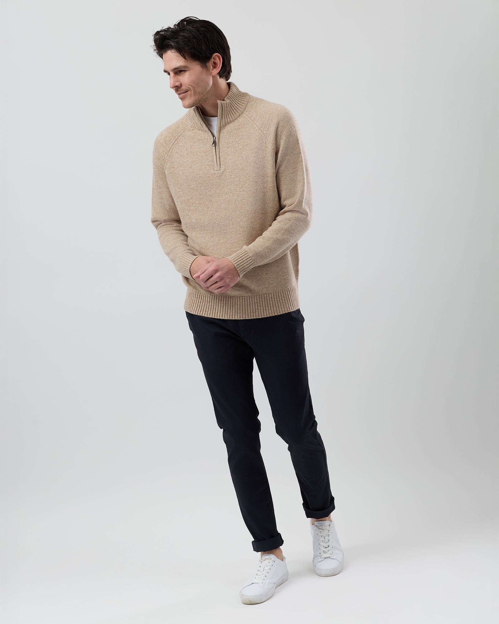 Full-length side profile of a men's oatmeal wool blend quarter zip jumper showing the regular fit and slim sleeve shape.
