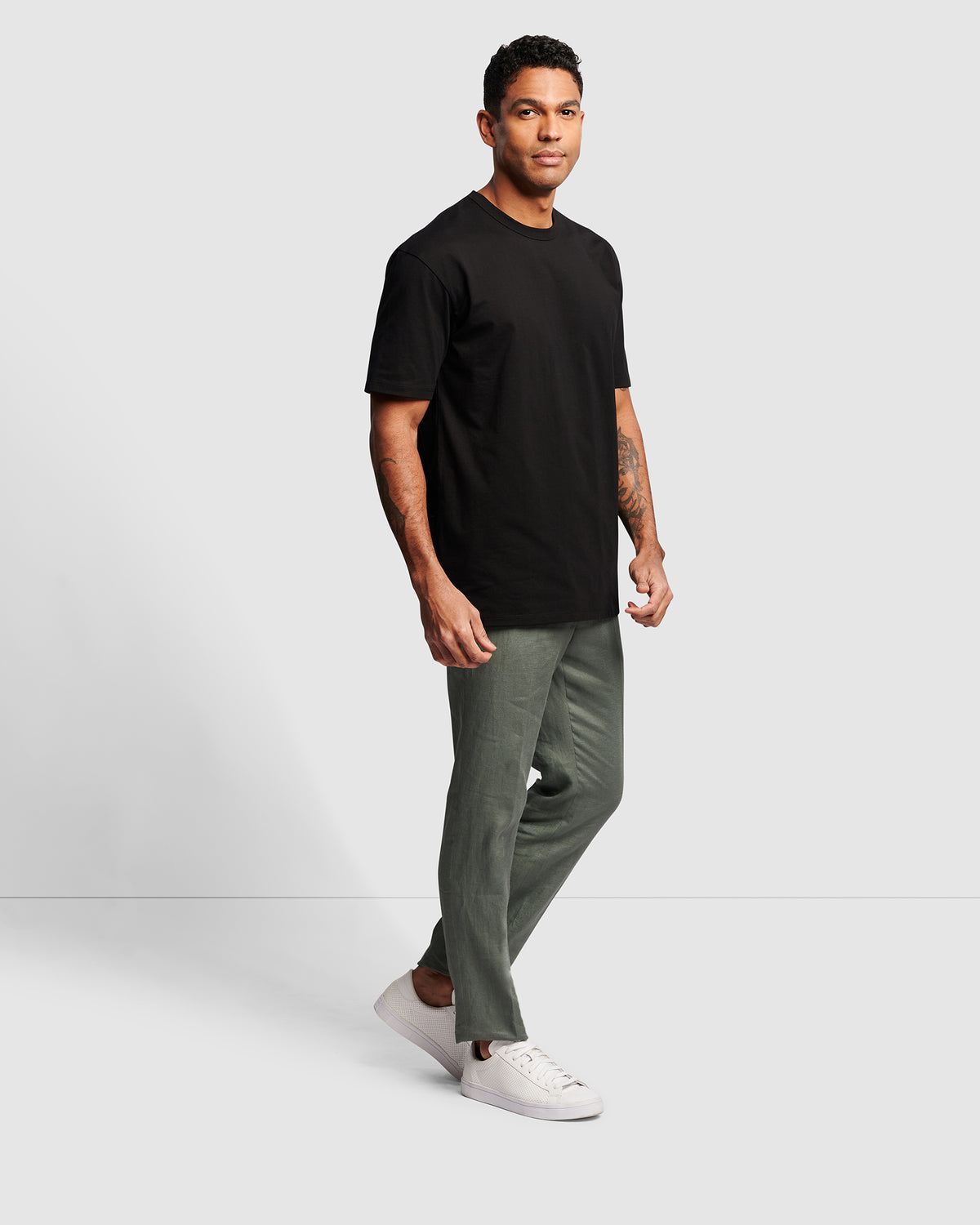 Oversized Men's Cotton T-Shirt in black, full body view worn with chinos