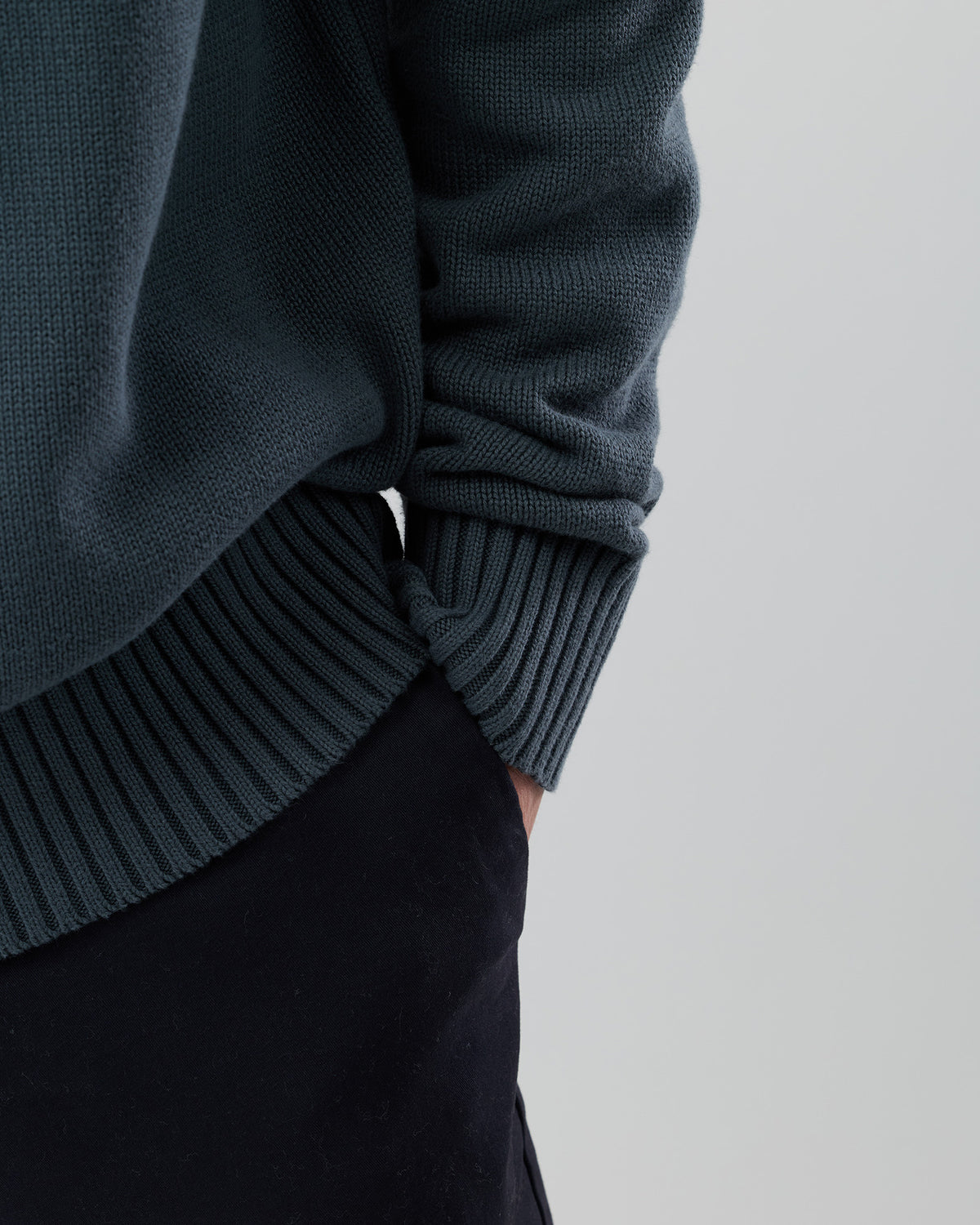 Close-up front view of the Wayver ironstone 100% cotton crew neck knit highlighting the soft cotton fabric and premium finish.