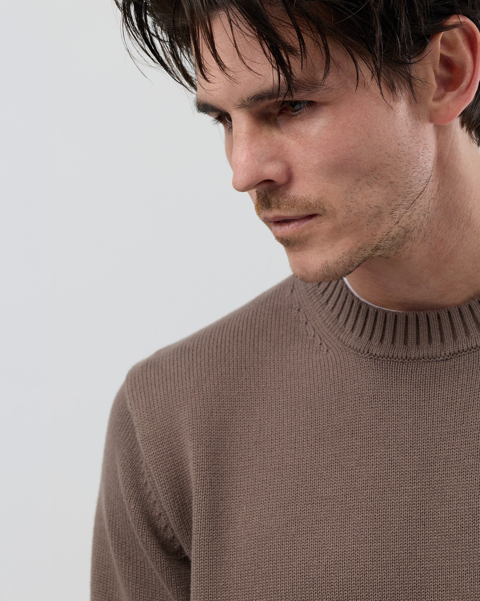 Close-up front view of the Wayver latte 100% cotton crew neck knit highlighting the soft cotton fabric and premium finish.