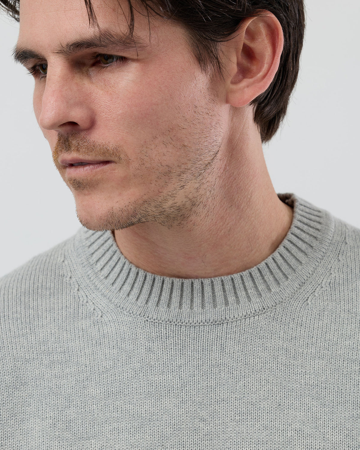 Close-up front view of the Wayver light grey 100% cotton crew neck knit highlighting the premium cotton texture and craftsmanship.