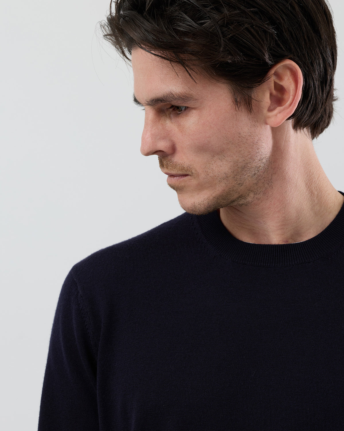 Close-up front view of a men's navy Australian ultrafine merino wool crew neck jumper showing the fine knit texture and premium finish.