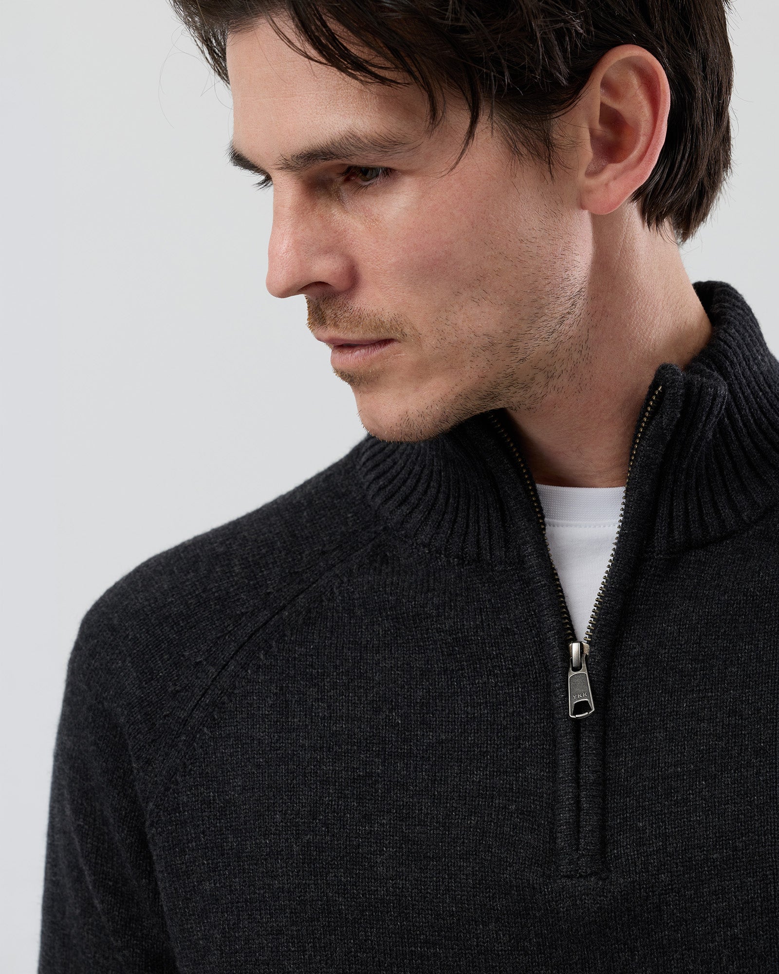Close-up front view of the Wayver charcoal wool blend half zip knit showing the YKK metal zip, stand collar and premium wool blend texture.
