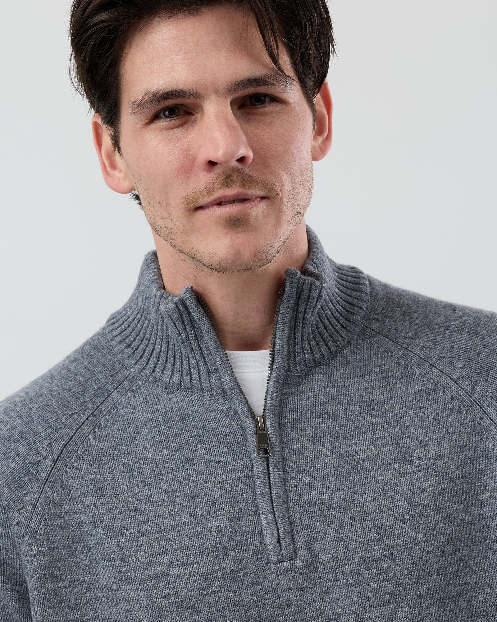 Close-up front view of the Wayver grey wool blend half zip knit showing the YKK metal zip, stand collar and premium wool blend texture.