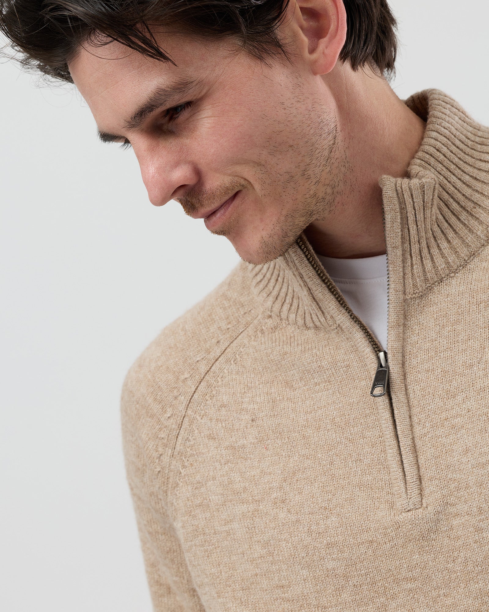 Close-up front view of the Wayver oatmeal wool blend half zip knit showing the YKK metal zip, stand collar and premium wool blend texture.