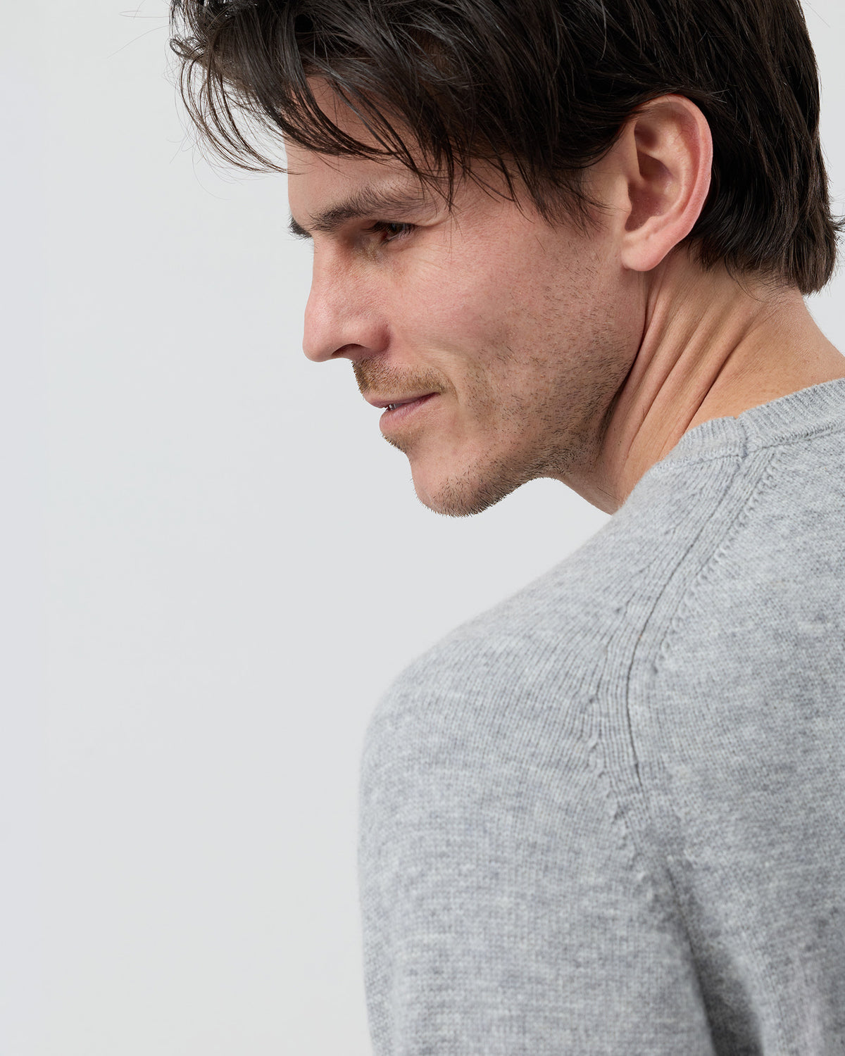 Close-up rear view of the Wayver light grey wool blend crew neck knit highlighting the premium saddle shoulder detail and fine gauge knit texture.