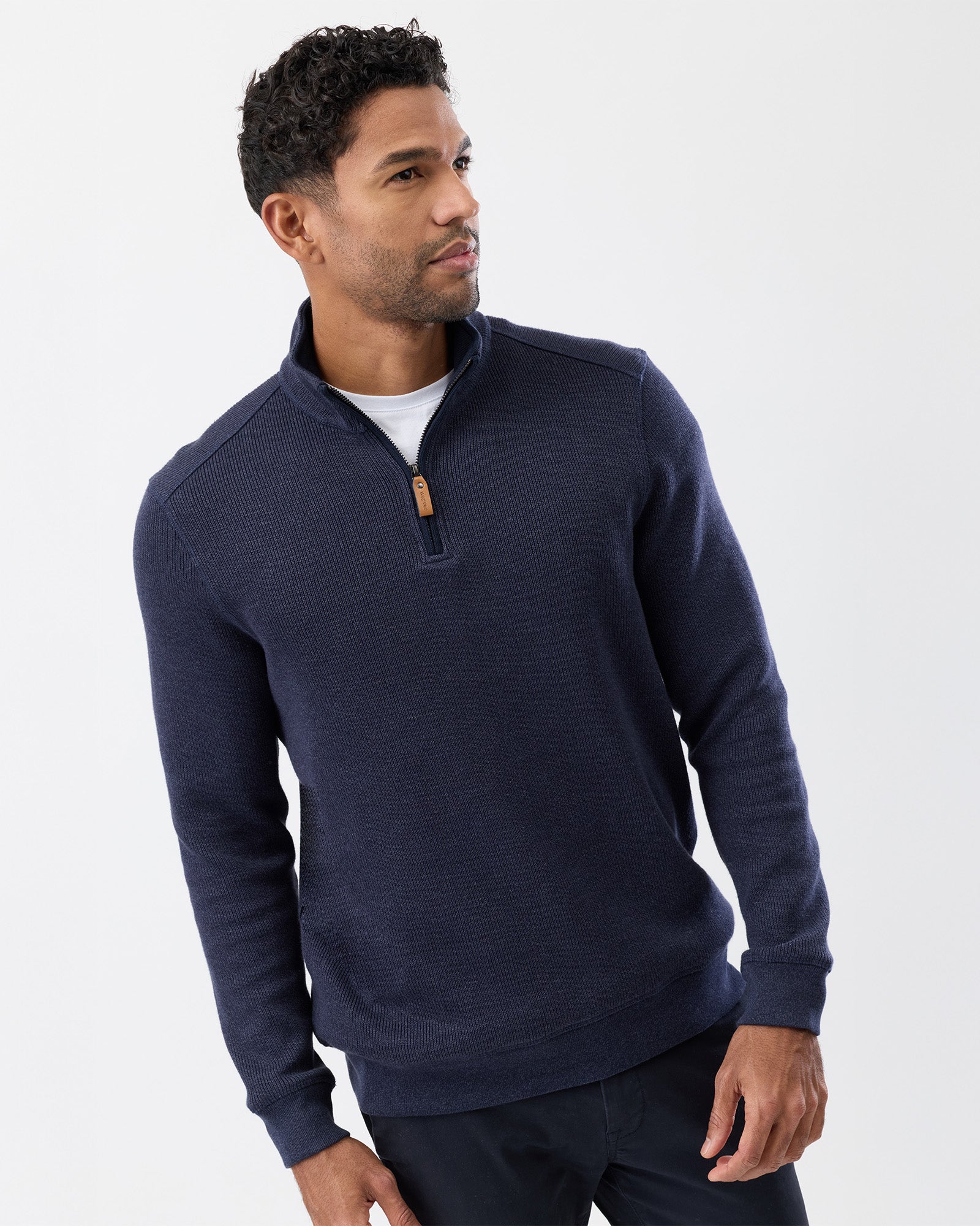 Detail shot of stand collar and zipper from french rib knit