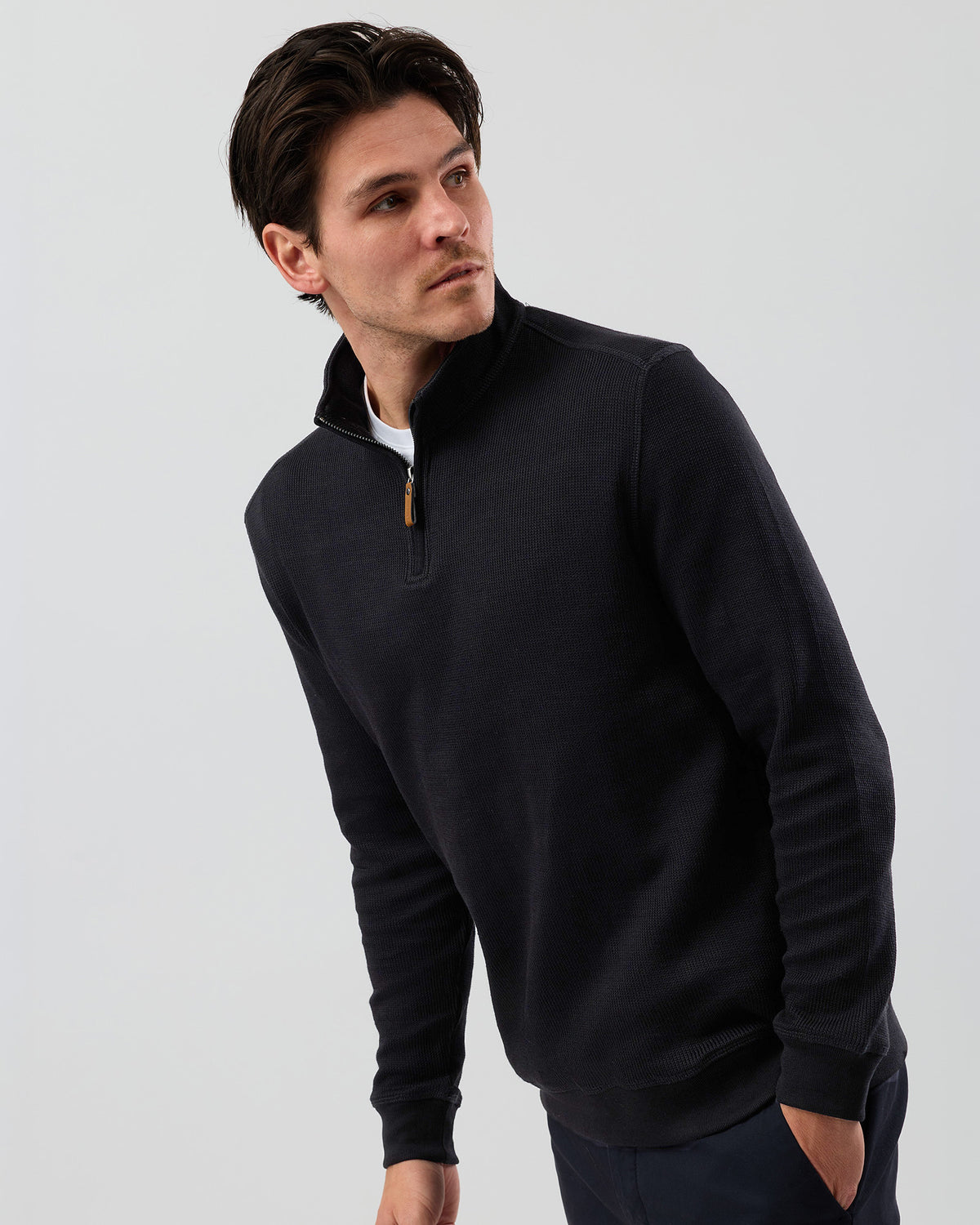Men's black French rib half zip sweater by Wayver Originals, featuring a textured cotton-rich knit, quarter zip neckline and stand collar.