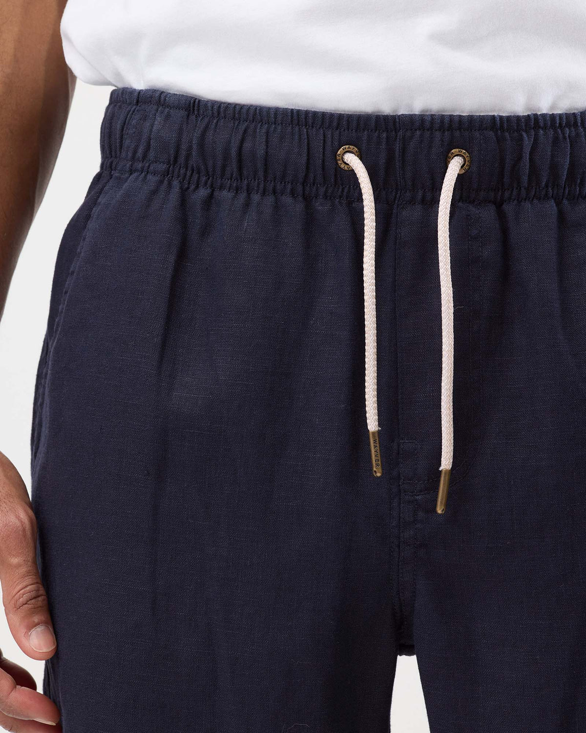 Navy linen shorts with elastic waistband, drawstring and metal eyelet detail