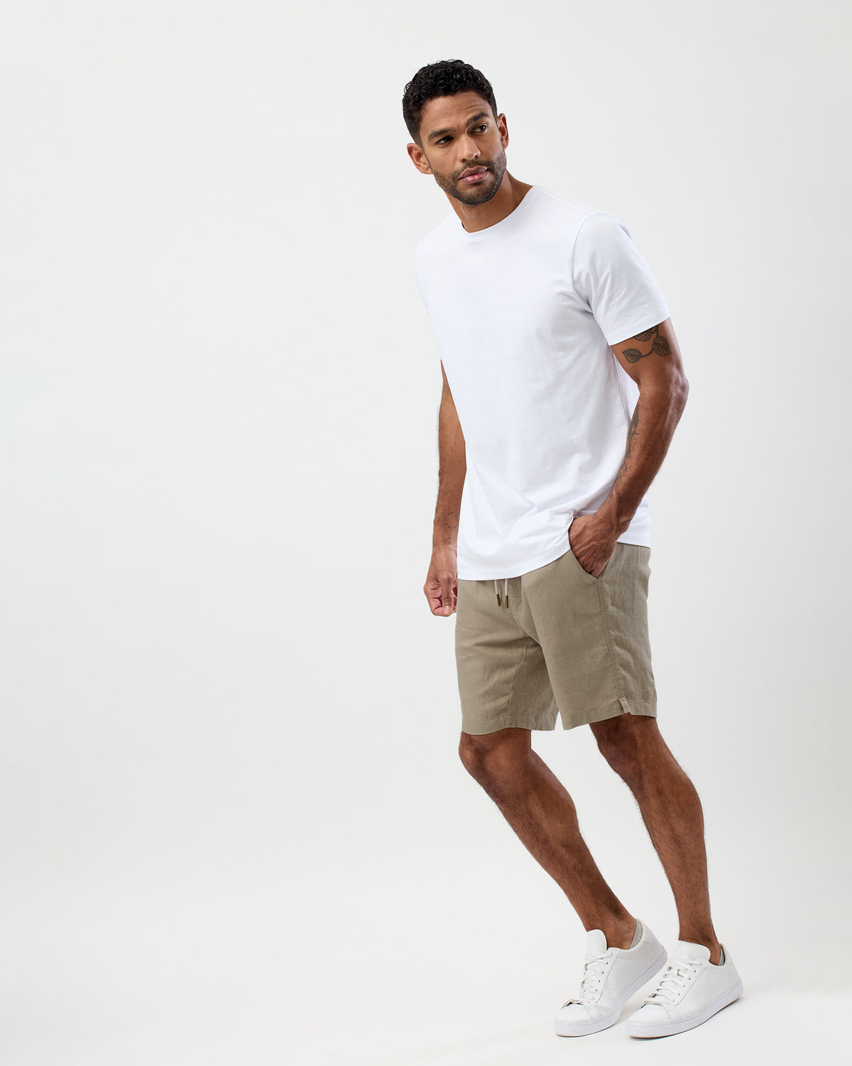 Men's oat 100% linen summer shorts styled with a white T-shirt
