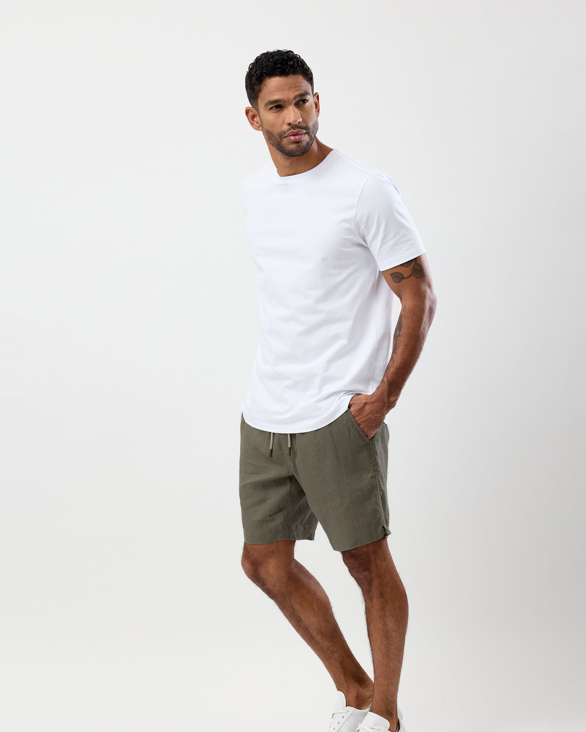 Men's olive 100% linen summer shorts styled with a white T-shirt