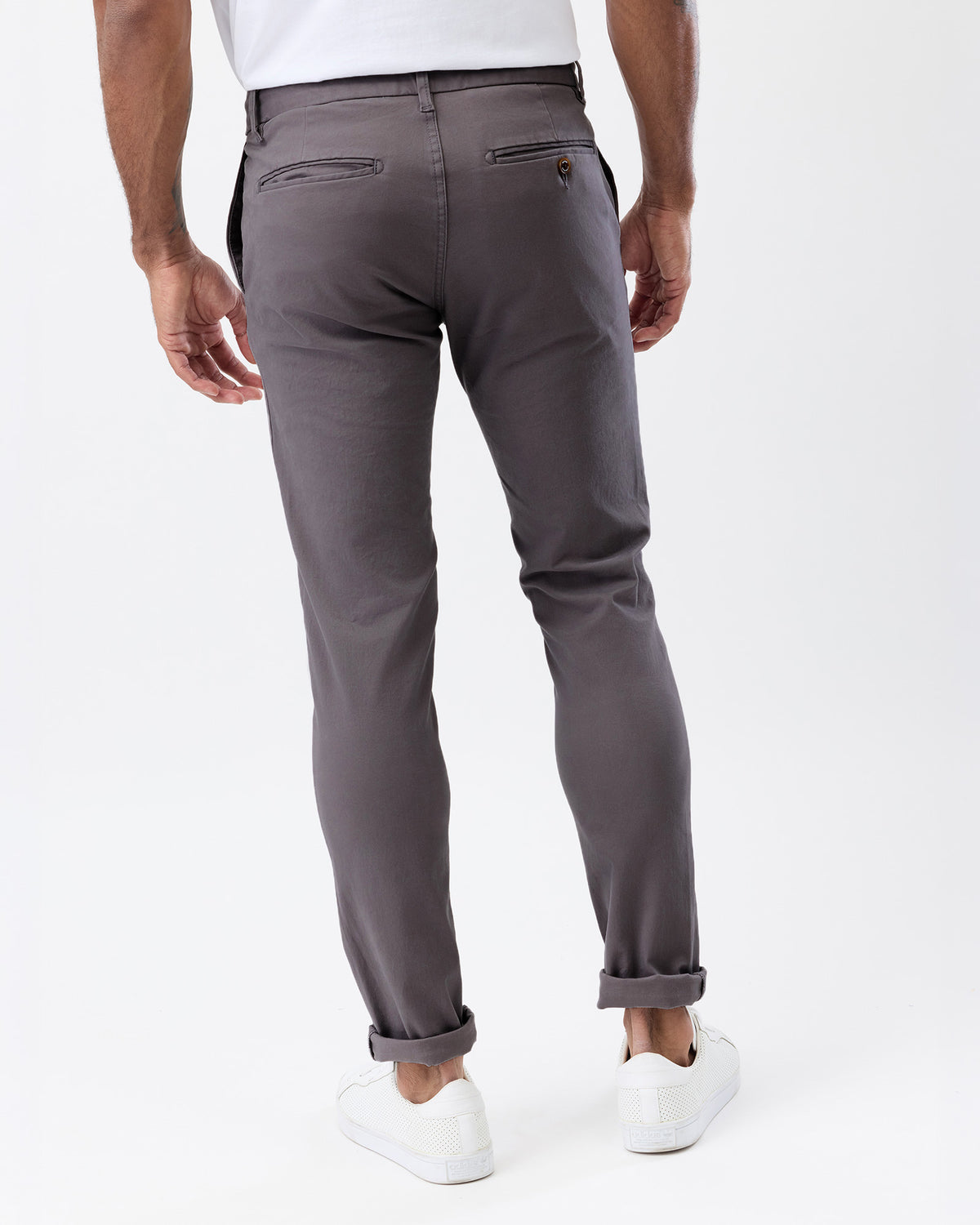 Rear view of Wayver Originals smoke grey slim fit chinos highlighting the back welt pockets and tailored silhouette.