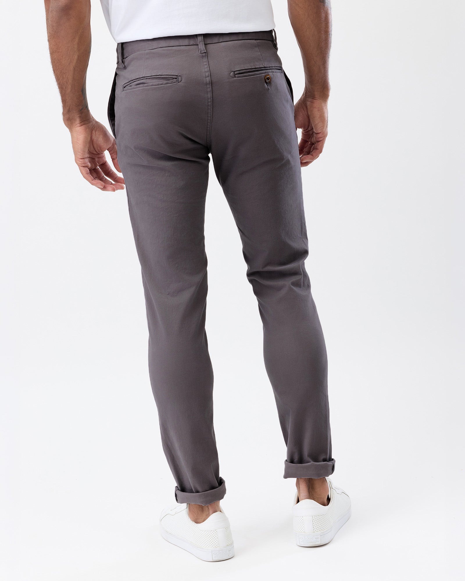 Rear view of Wayver Originals smoke grey slim fit chinos highlighting the back welt pockets and tailored silhouette.