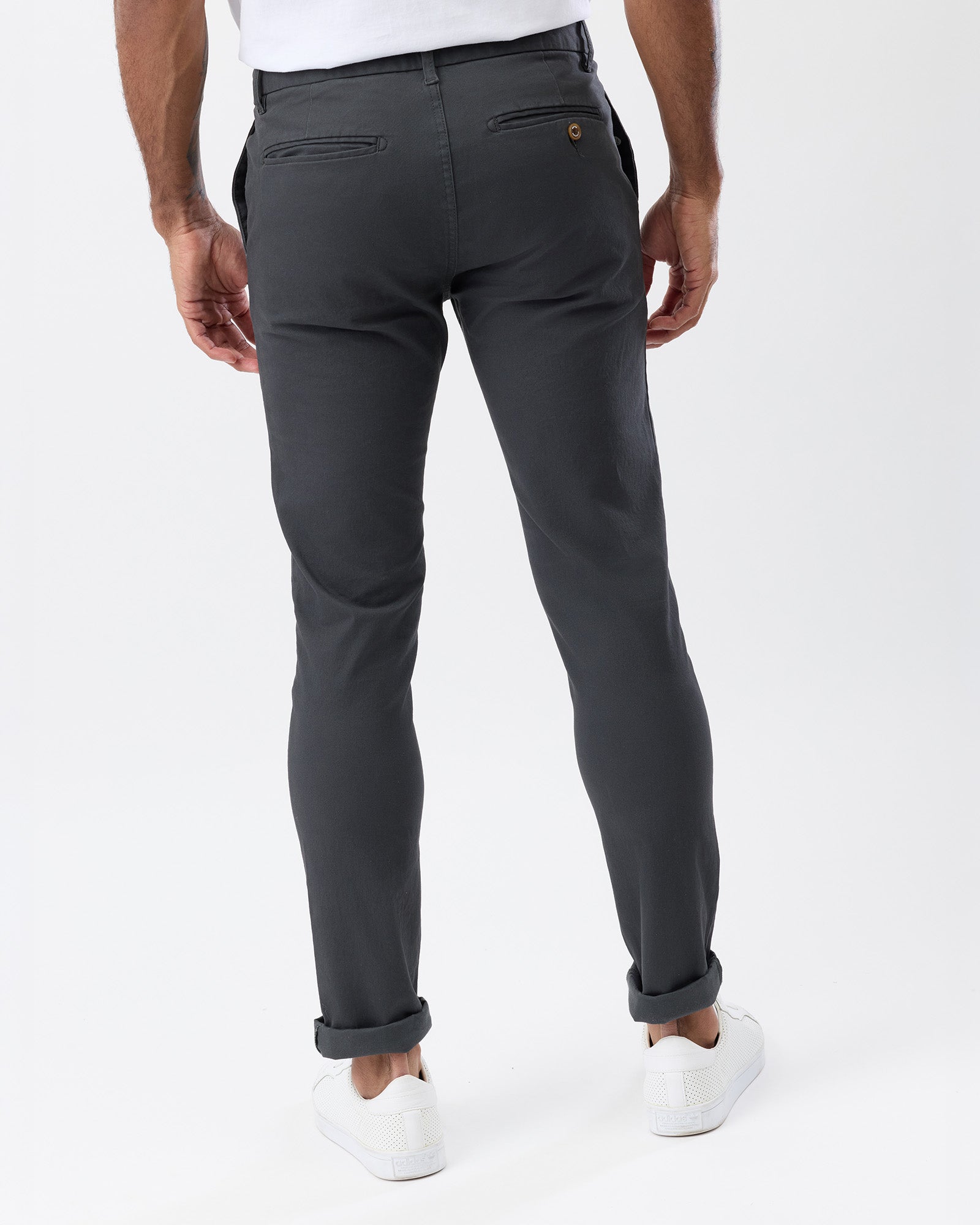 Rear view of Wayver Originals charcoal chinos showing back pockets and slim fit.