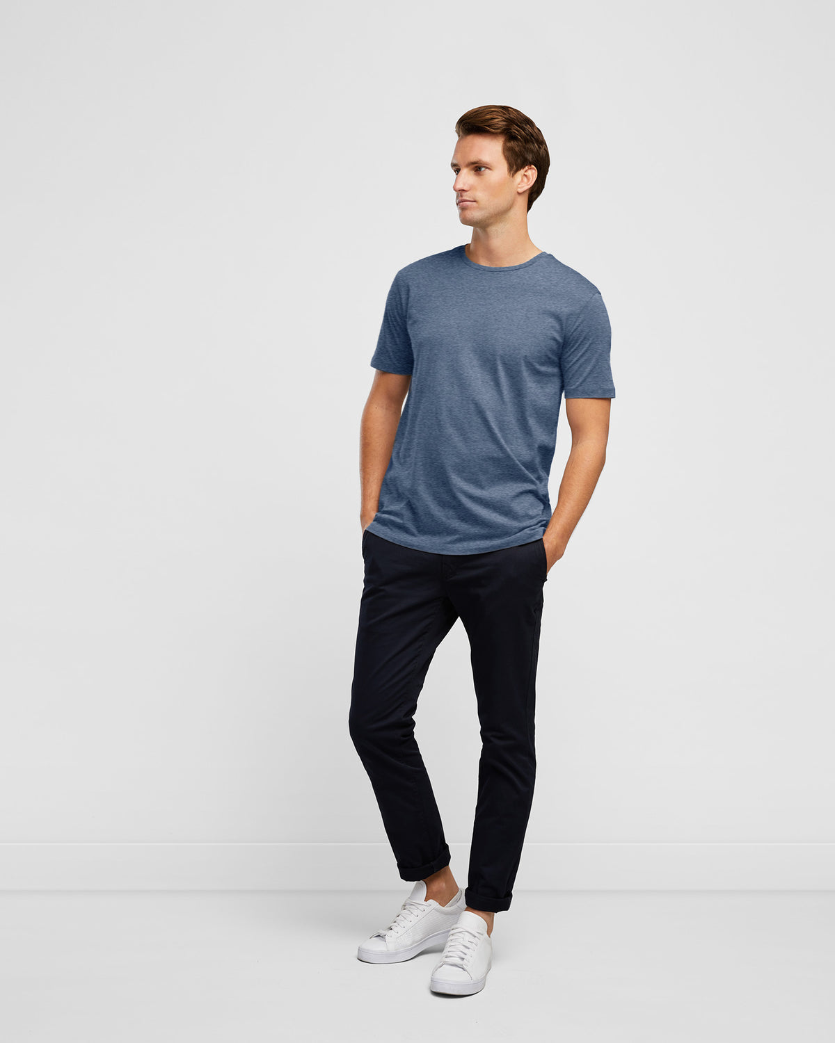 Men&#39;s Essential Crew Neck Tee in Ocean Blue, full body image worn with navy chino pants