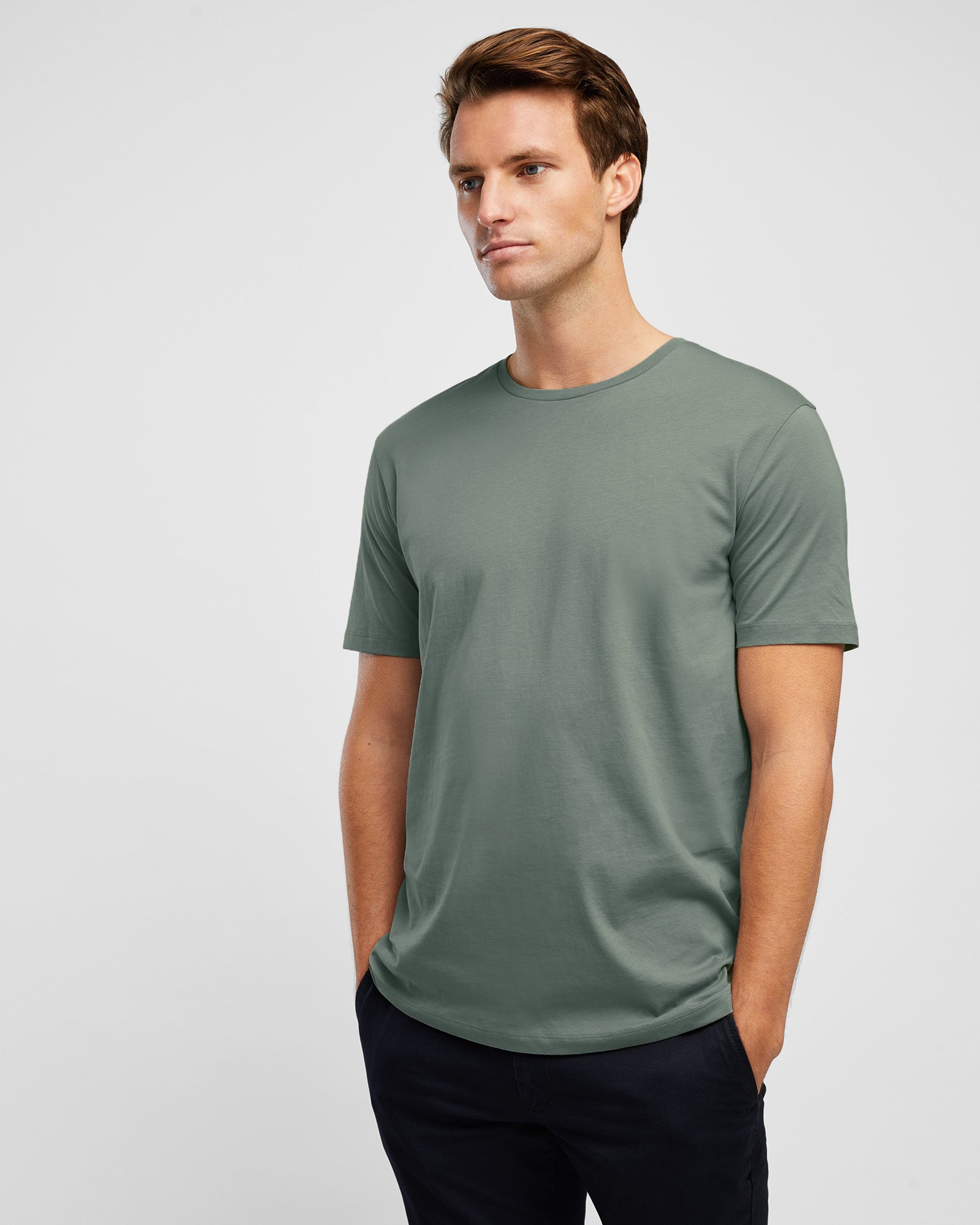 Short sleeve cotton tee in sage green, on model close up image
