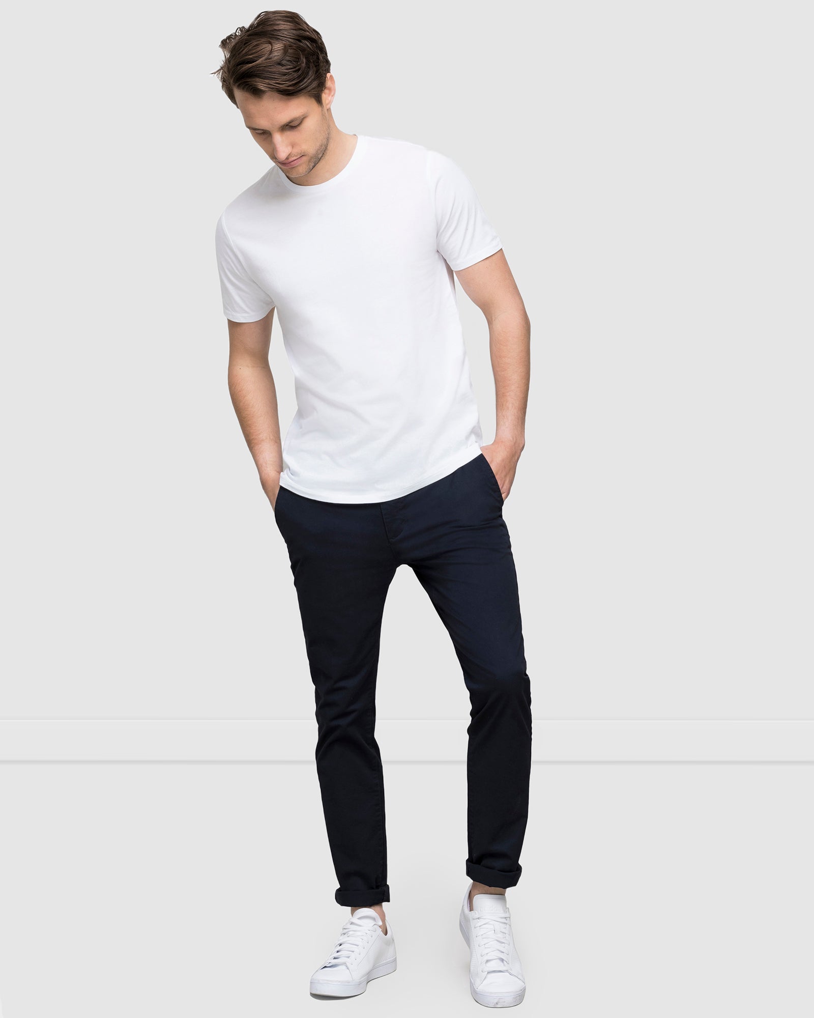 Men’s cotton stretch chinos in navy, slim fit with white t-shirt and sneakers