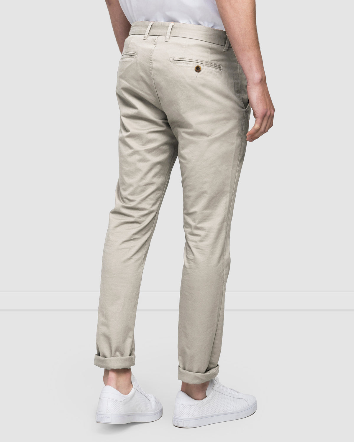 Men's chinos in a compact cotton twill in pebble colour, rear view