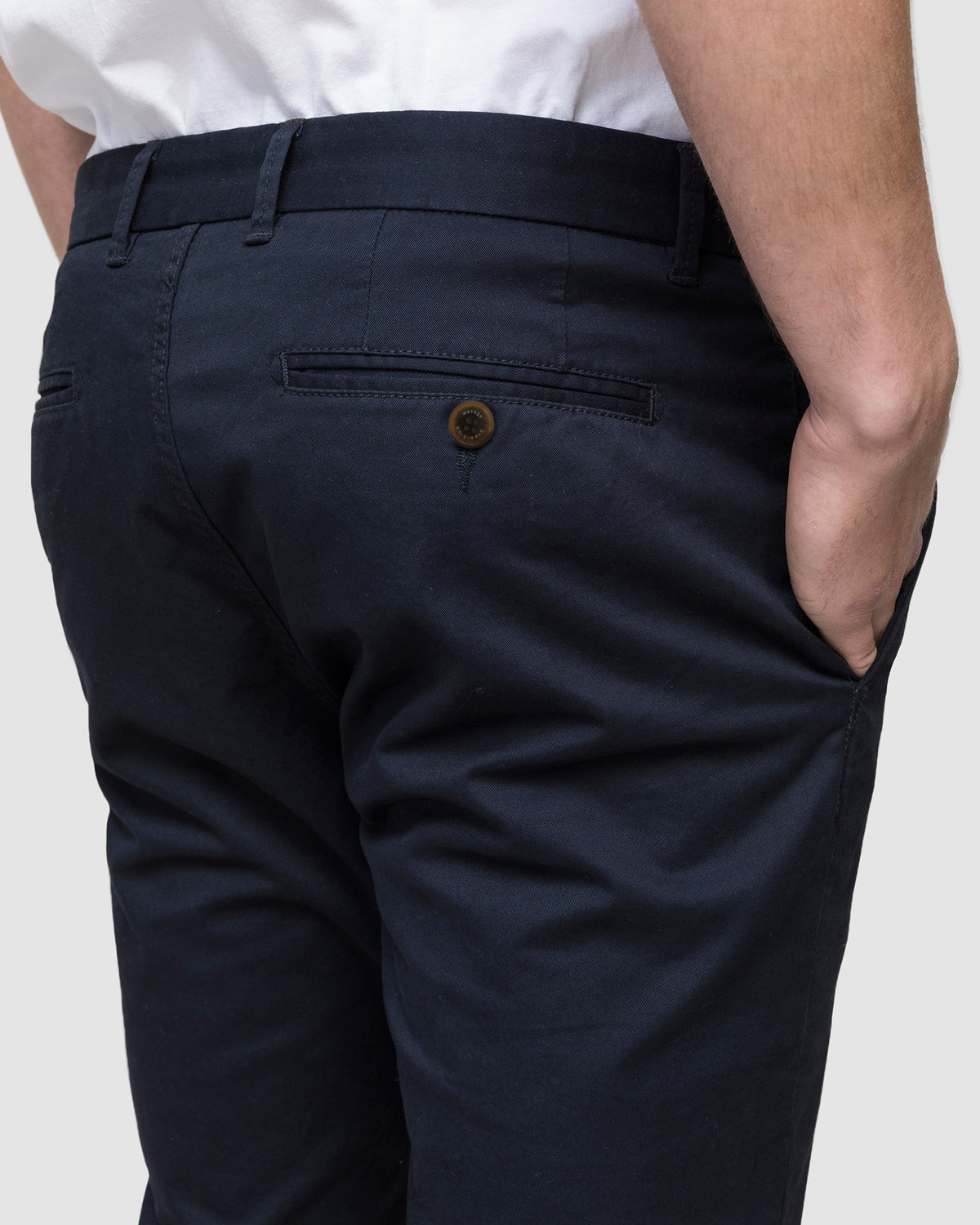 Back close up view of navy chino pants with buttoned jet pocket, by Wayver